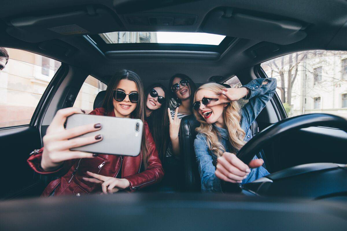 Friends taking a selfie on a road trip