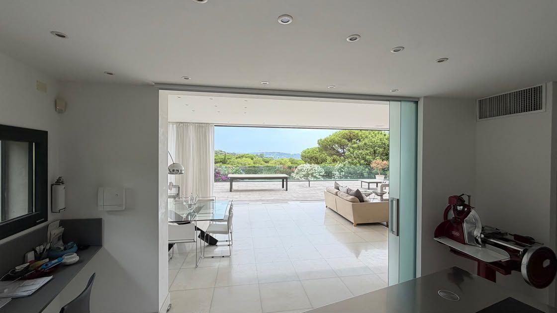 The kitchen opening to the terrace and the view